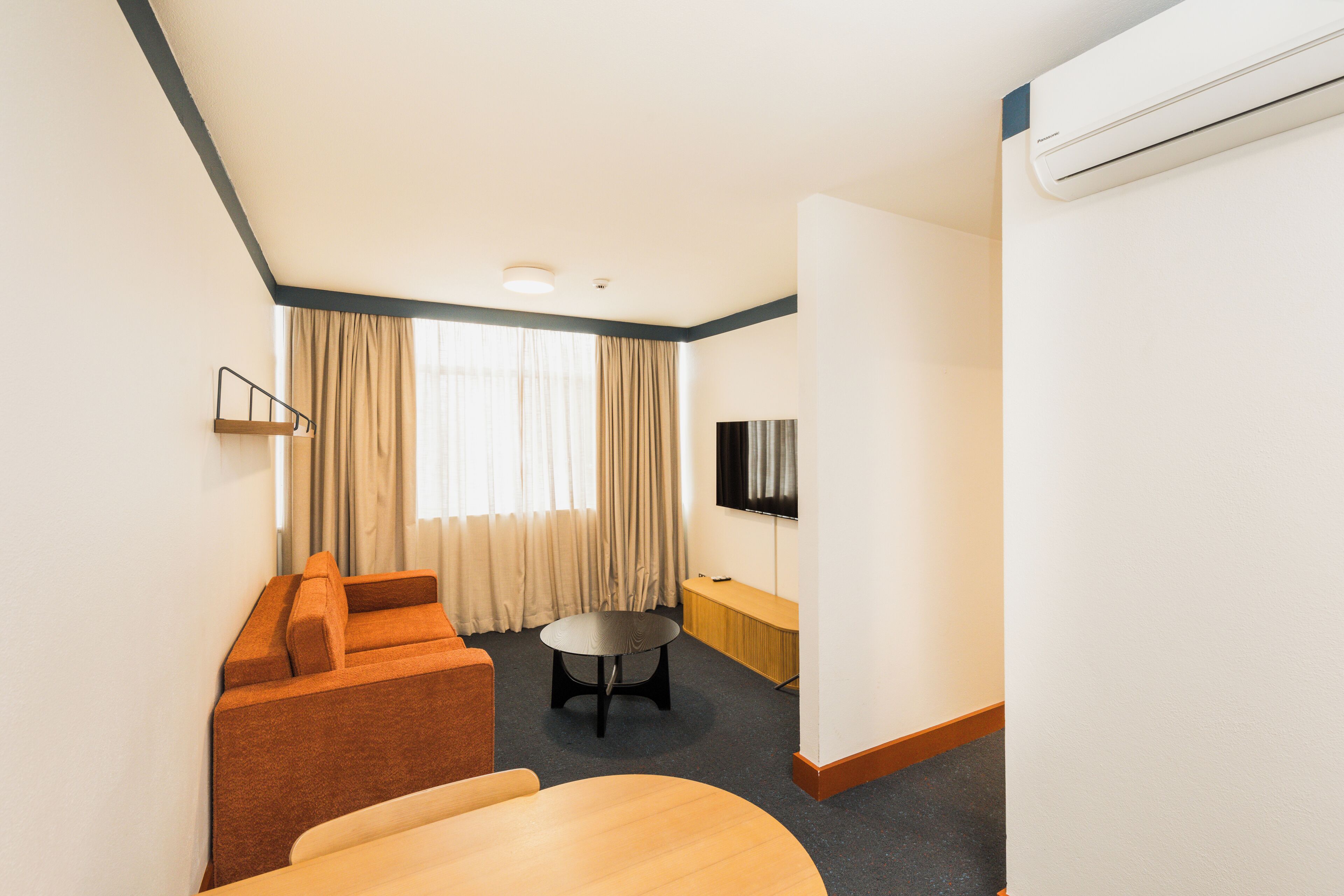 queen sofa studio | living area | flat-screen tv