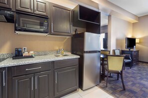 Premium bedding, desk, laptop workspace, blackout drapes