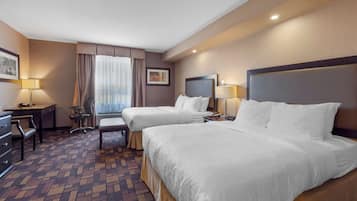 Premium bedding, desk, laptop workspace, blackout drapes