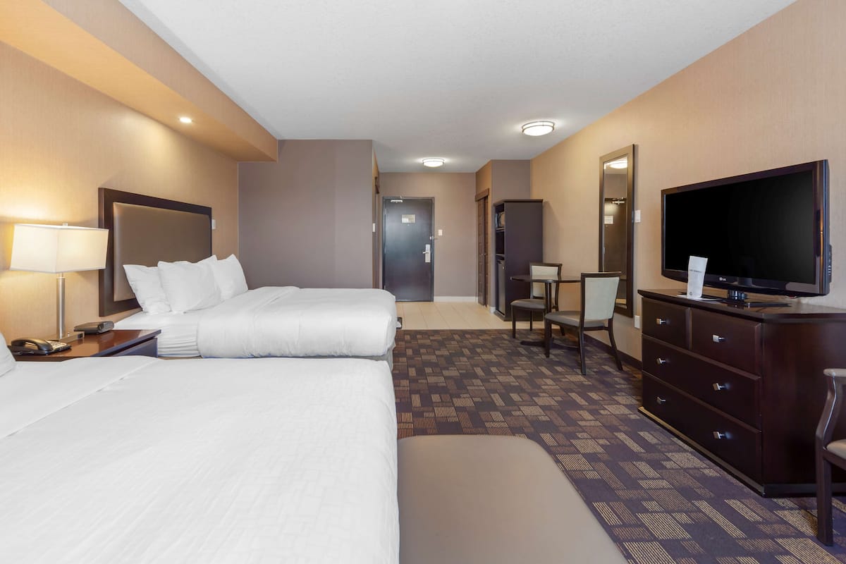 Premium bedding, desk, laptop workspace, blackout curtains