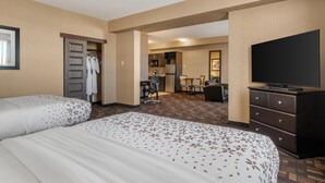 A hotel room with two beds, a TV, a desk, and a kitchenette. - Best Western Plus Fox Creek (Fox Creek)