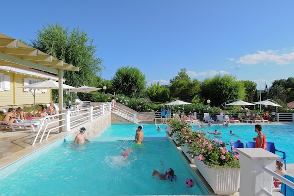 2 outdoor pools, open 9:30 AM to 7 PM, pool umbrellas, pool loungers