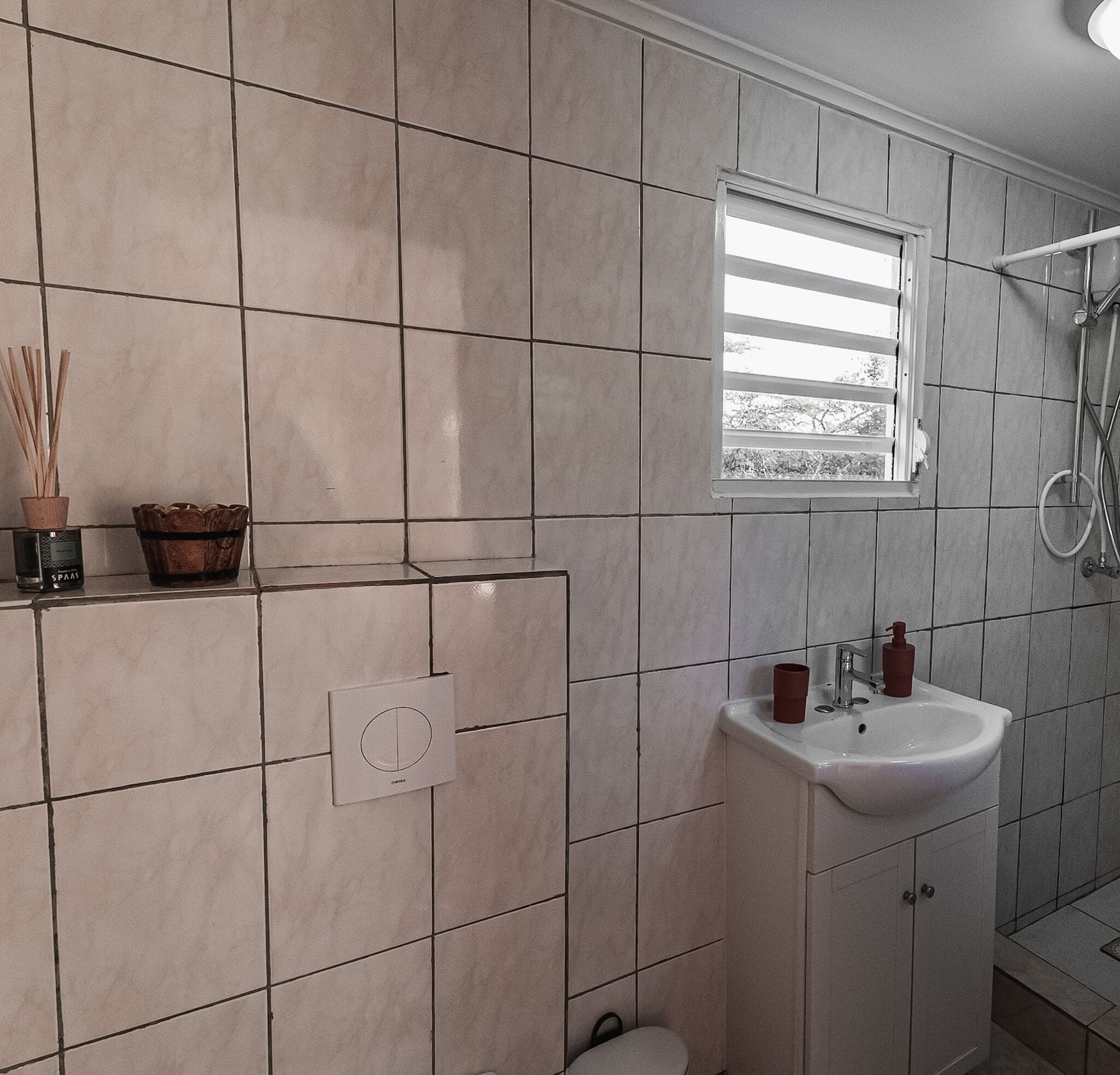 deluxe room, 1 king bed | bathroom | shower, hair dryer, towels