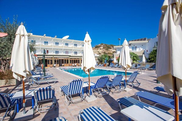 Outdoor pool, open 9:00 AM to 6:30 PM, pool umbrellas, sun loungers