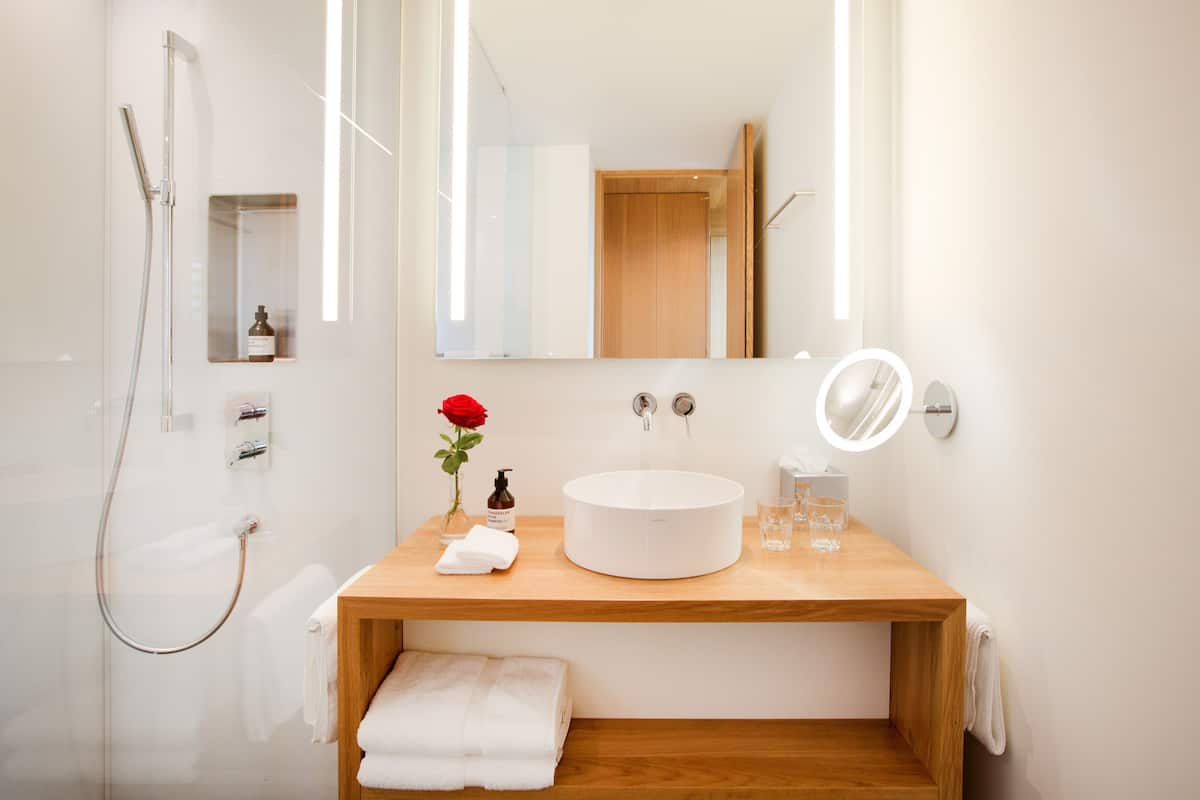 junior suite, 1 double bed, balcony | bathroom | shower, eco-friendly toiletries, hair dryer, bathrobes