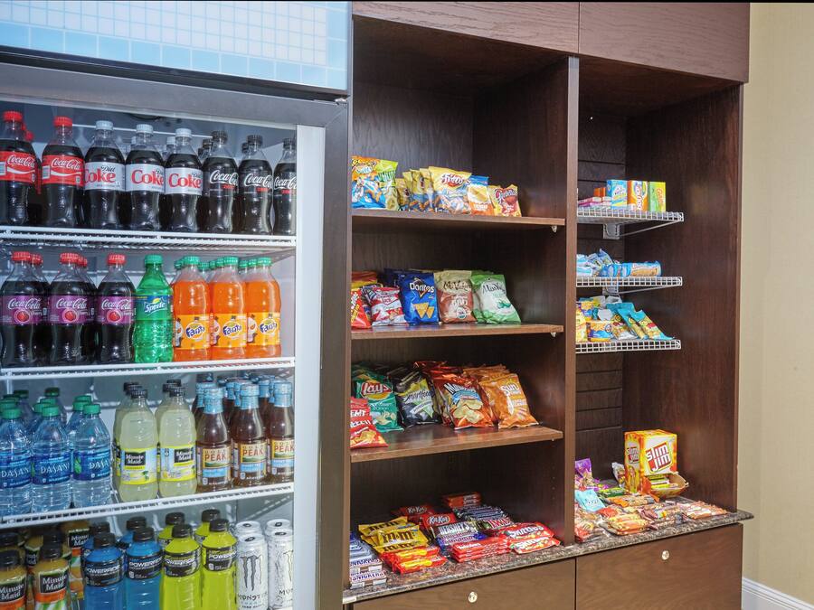 A vending machine stocked with beverages and snacks.
