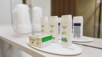 Dove shampoo bottles and a box on a white surface.