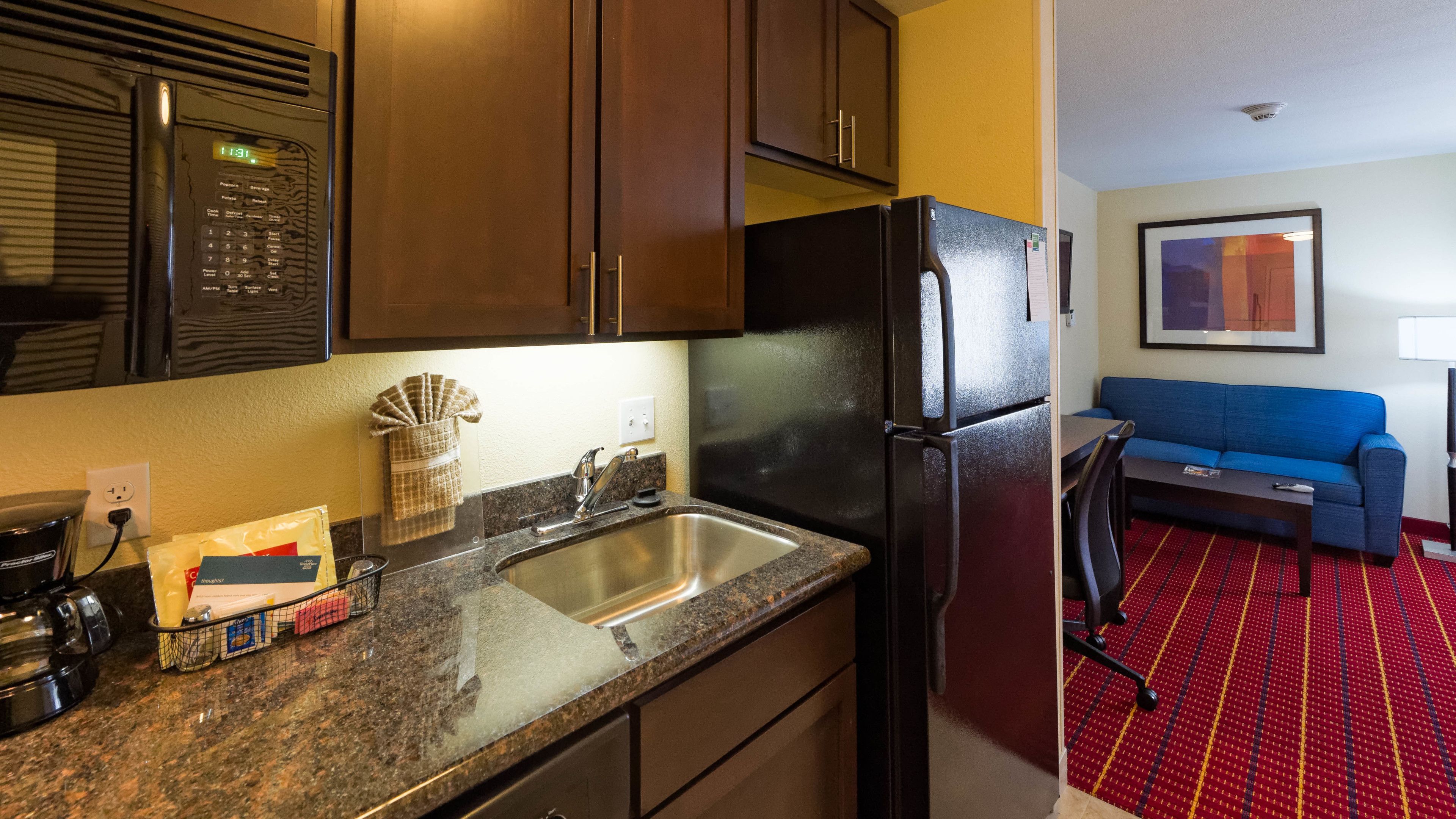 full-sized fridge, microwave, stovetop, dishwasher