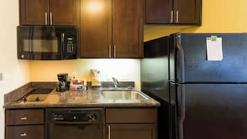 Full-sized fridge, microwave, stovetop, dishwasher