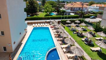 Seasonal outdoor pool, pool umbrellas, pool loungers