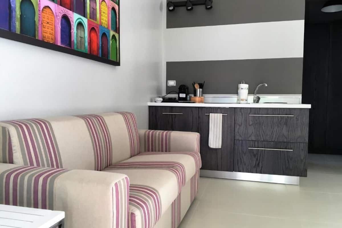 ada apartment | living area | 24-inch lcd tv with digital channels, tv