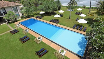 Outdoor pool, pool umbrellas, sun loungers