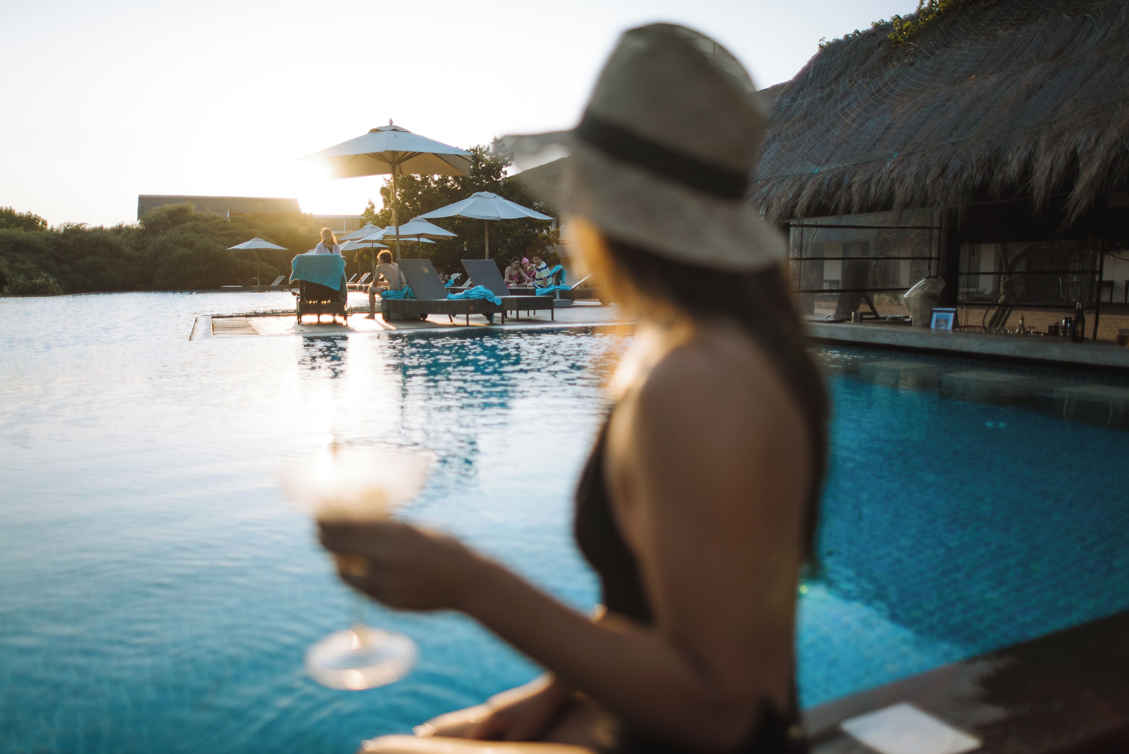 outdoor pool, open 7 am to 7 pm, pool umbrellas, pool loungers