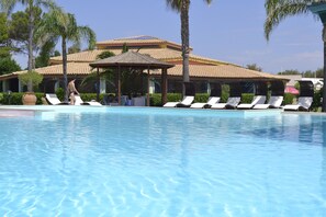Seasonal outdoor pool, pool loungers