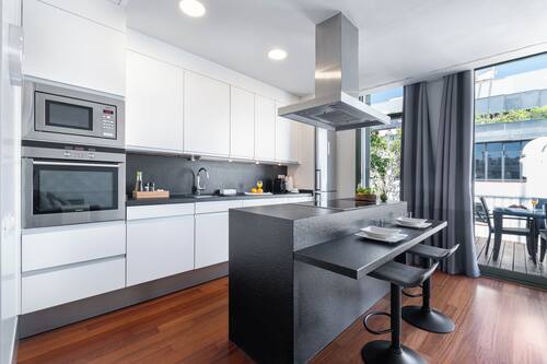 Penthouse, Courtyard View | Private kitchen | Full-size fridge, microwave, oven, stovetop
