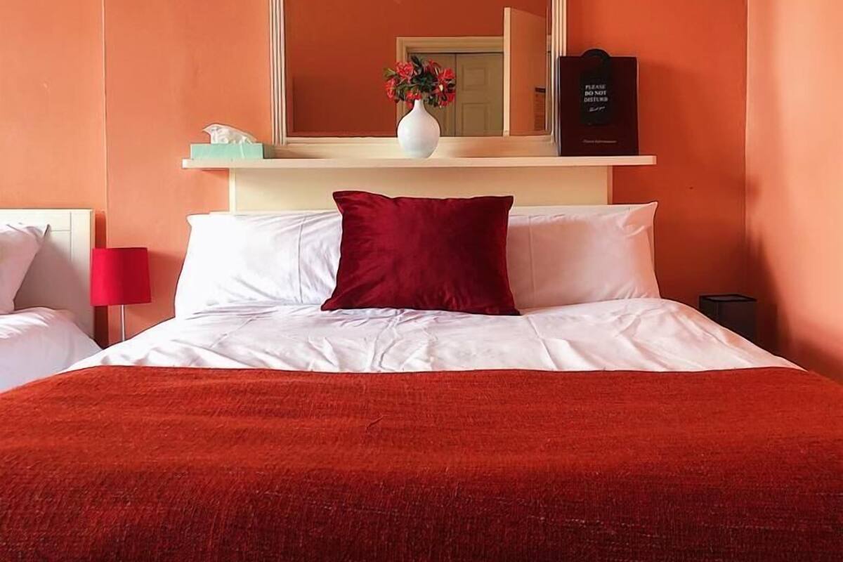 Quad Room, 1 Double Bed and 2 Single Beds | Desk, blackout drapes, iron/ironing board, WiFi (free)