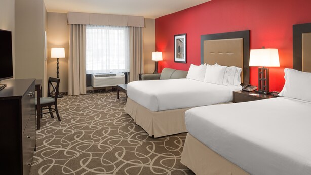 A hotel room with two beds, a desk, a chair, a TV, and a window with curtains. - Holiday Inn Express Klamath - Redwood Ntl Pk Area by IHG (Klamath)