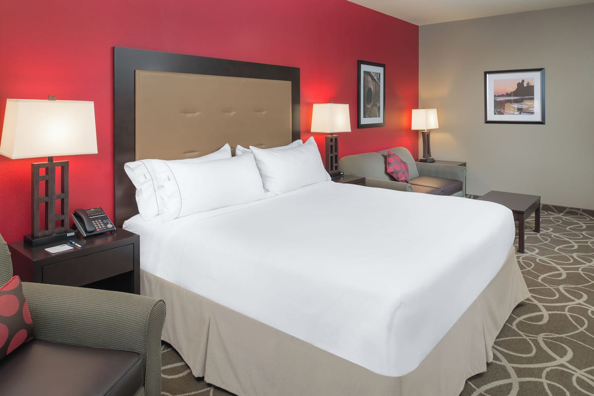 Hypo-allergenic bedding, laptop workspace, blackout curtains