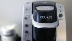 A coffee maker with the brand name KEURIG. - Holiday Inn Express Klamath - Redwood Ntl Pk Area by IHG (Klamath)