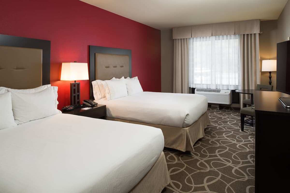 Hypo-allergenic bedding, laptop workspace, blackout curtains