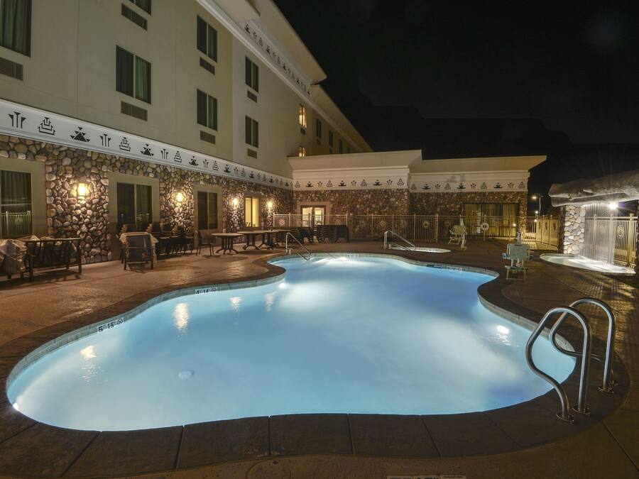 Outdoor pool, open 6:00 AM to 11:00 PM, pool umbrellas, sun loungers