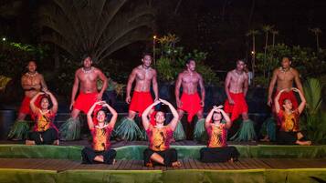 A stage with performers in traditional attire.