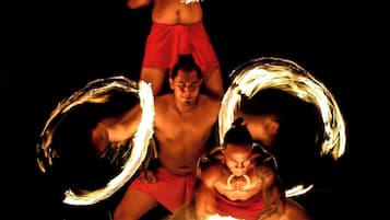 A group of performers with fire hoops, suggesting an outdoor event or performance.