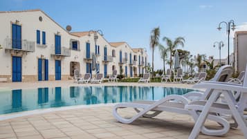 Seasonal outdoor pool, cabanas (surcharge), pool umbrellas