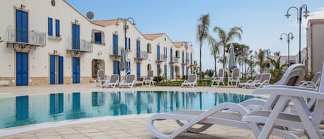 Seasonal outdoor pool, cabanas (surcharge), pool umbrellas