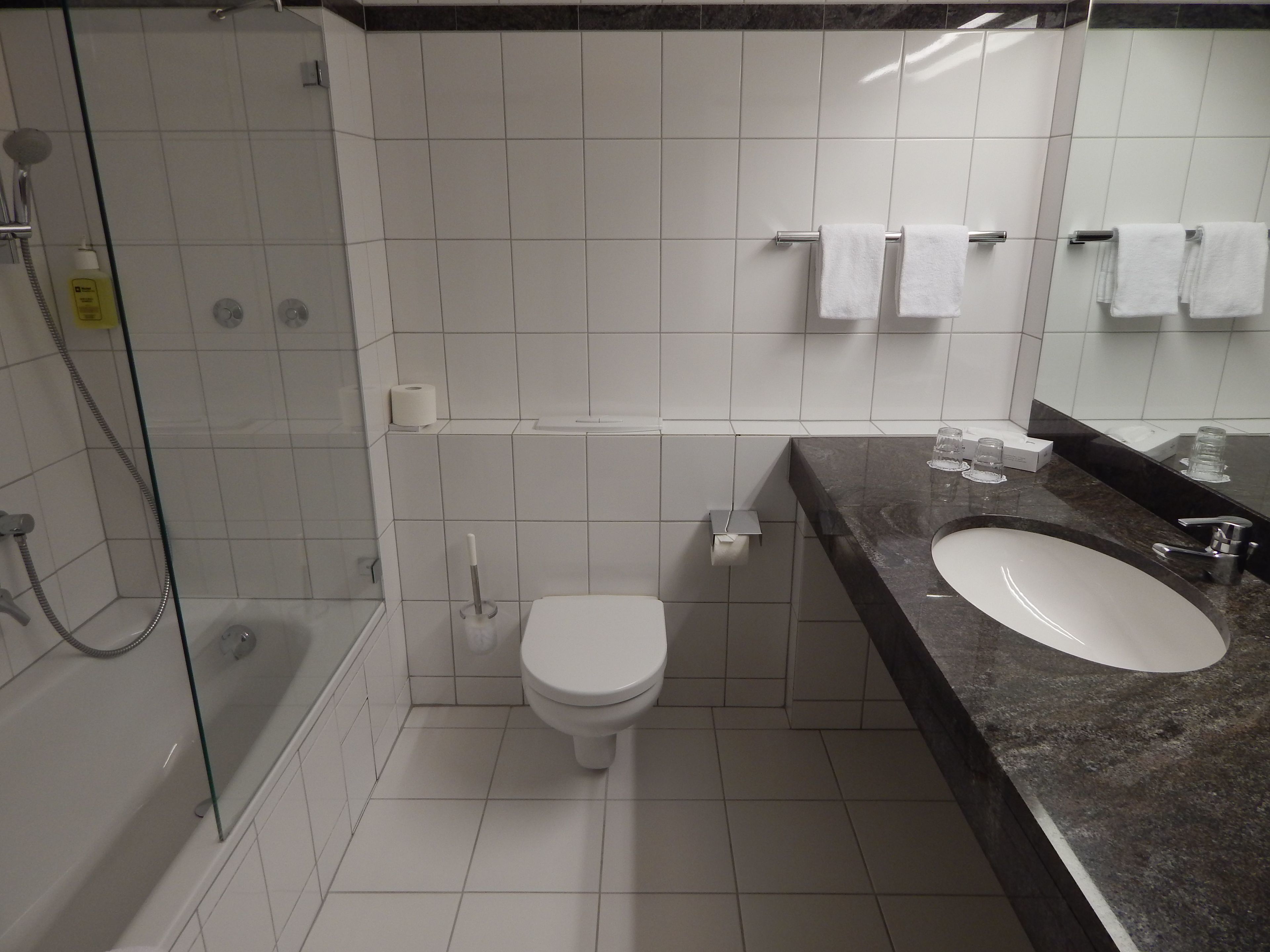 comfort single room, courtyard area | in-room safe, desk, blackout curtains, soundproofing