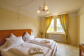 Desk, blackout curtains, iron/ironing board, rollaway beds