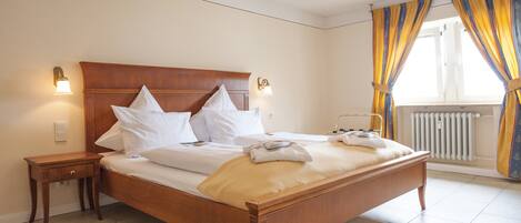 Desk, blackout curtains, iron/ironing board, rollaway beds