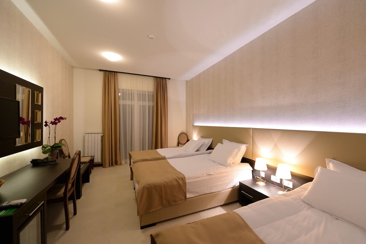 Triple Room | Premium bedding, minibar, in-room safe, desk