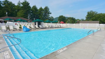 Seasonal outdoor pool, open 10:00 AM to 7:00 PM, pool umbrellas