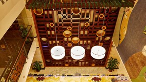 A hotel lobby with a reception desk, a decorative ceiling, and a marble floor. - Six Seasons Hotel (Dhaka)
