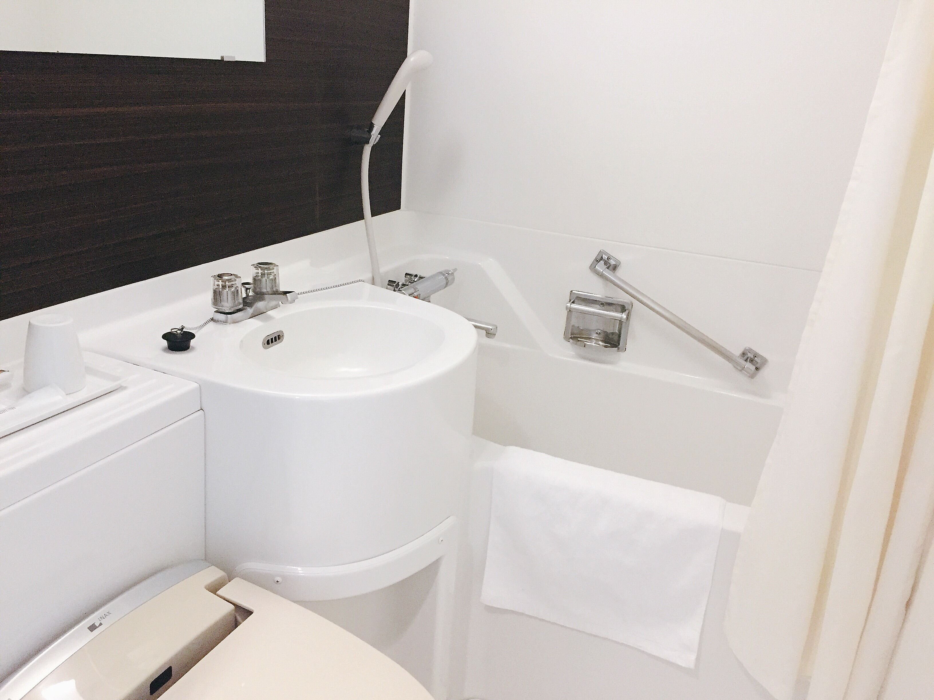 hair dryer, slippers, electronic bidet, towels