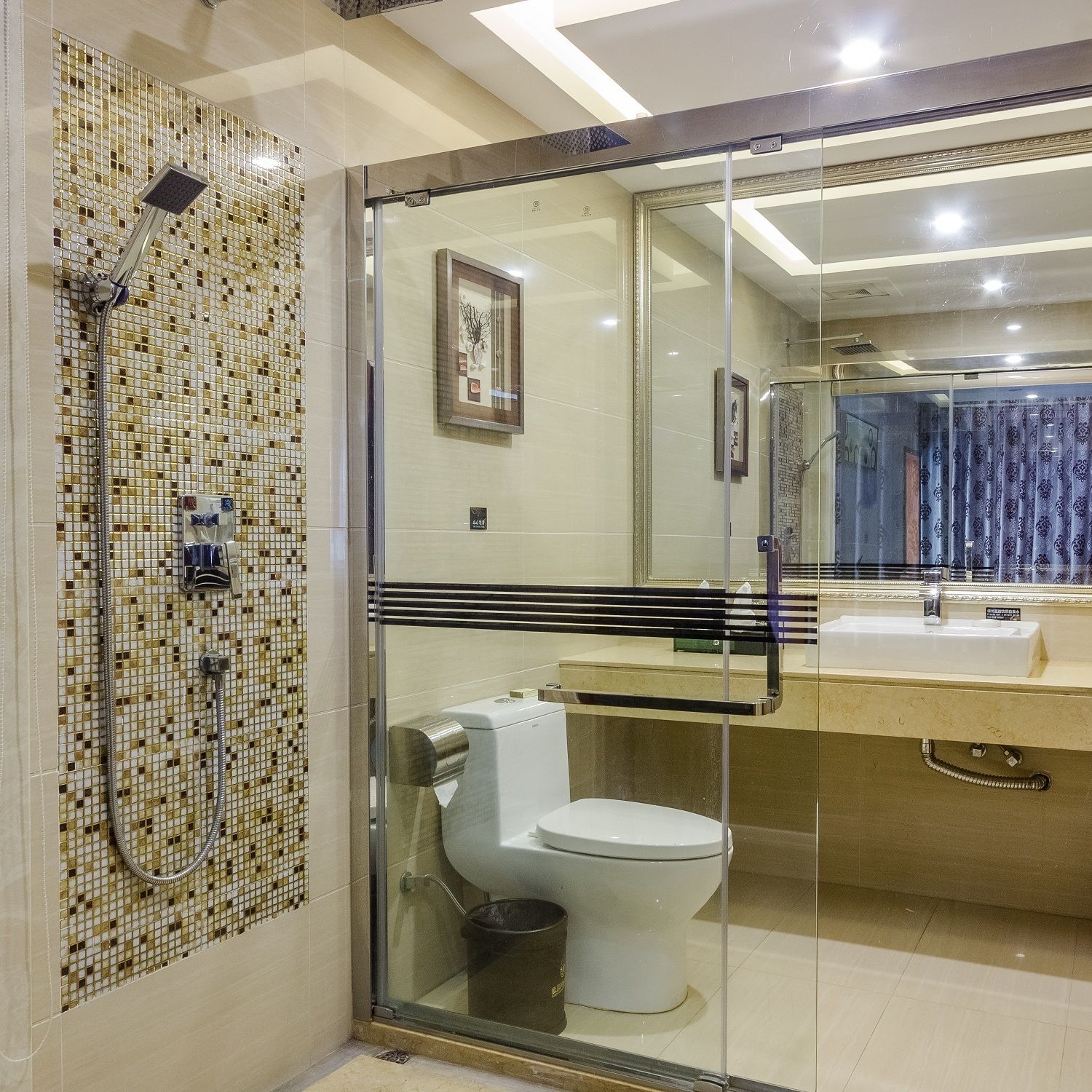 A modern bathroom with a glass-enclosed shower, a toilet, and a sink with a mirror above it.