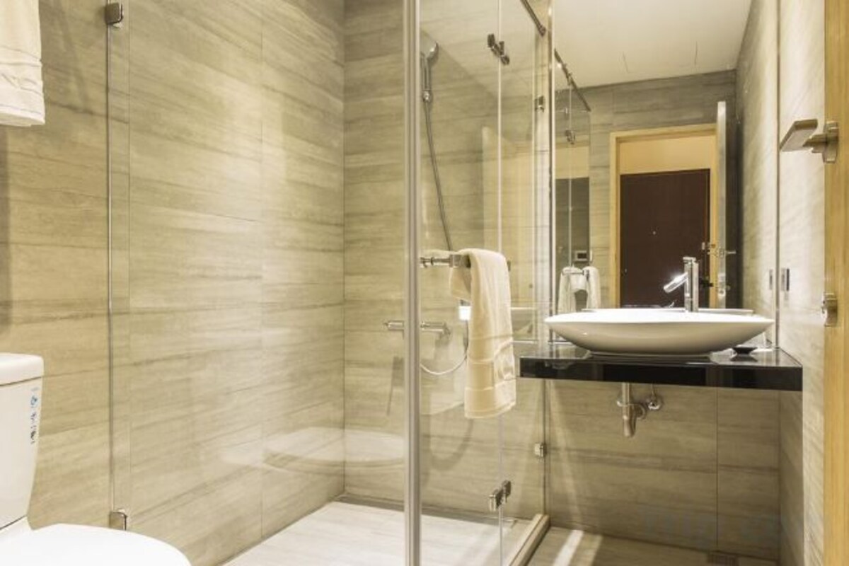 Bathroom | Shower, hair dryer, slippers, towels