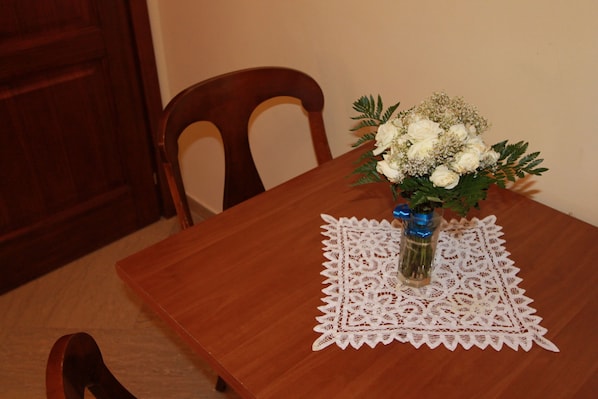 A beautifully set dining area with a table, chair, and elegant centerpiece.