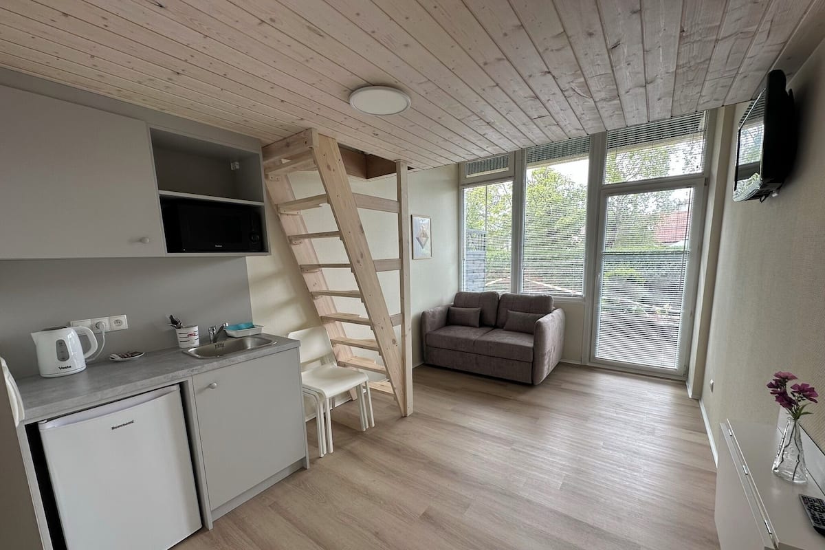 Family Quadruple Room | In-room safe, desk, iron/ironing board