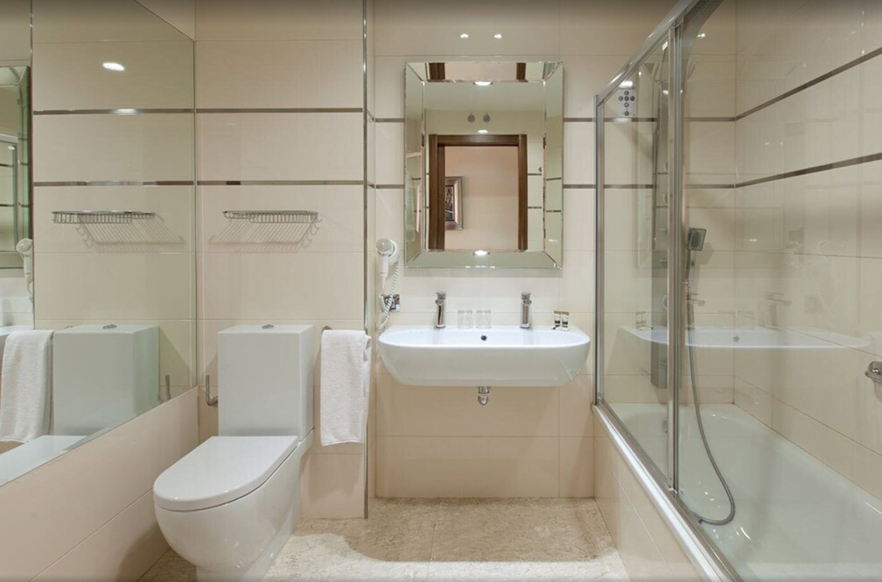 designer toiletries, hair dryer, towels