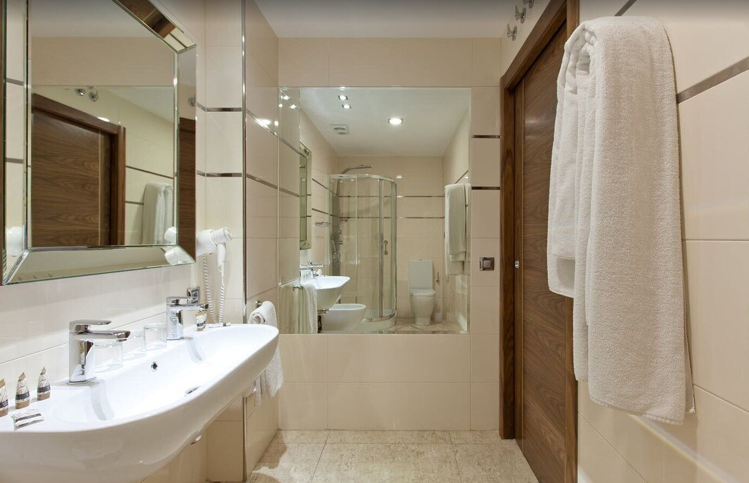 designer toiletries, hair dryer, towels