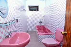 Standard Double Room, Courtyard View | Bathroom | Shower, hair dryer, slippers, towels - Hotel Travel-Inn (Pokhara)
