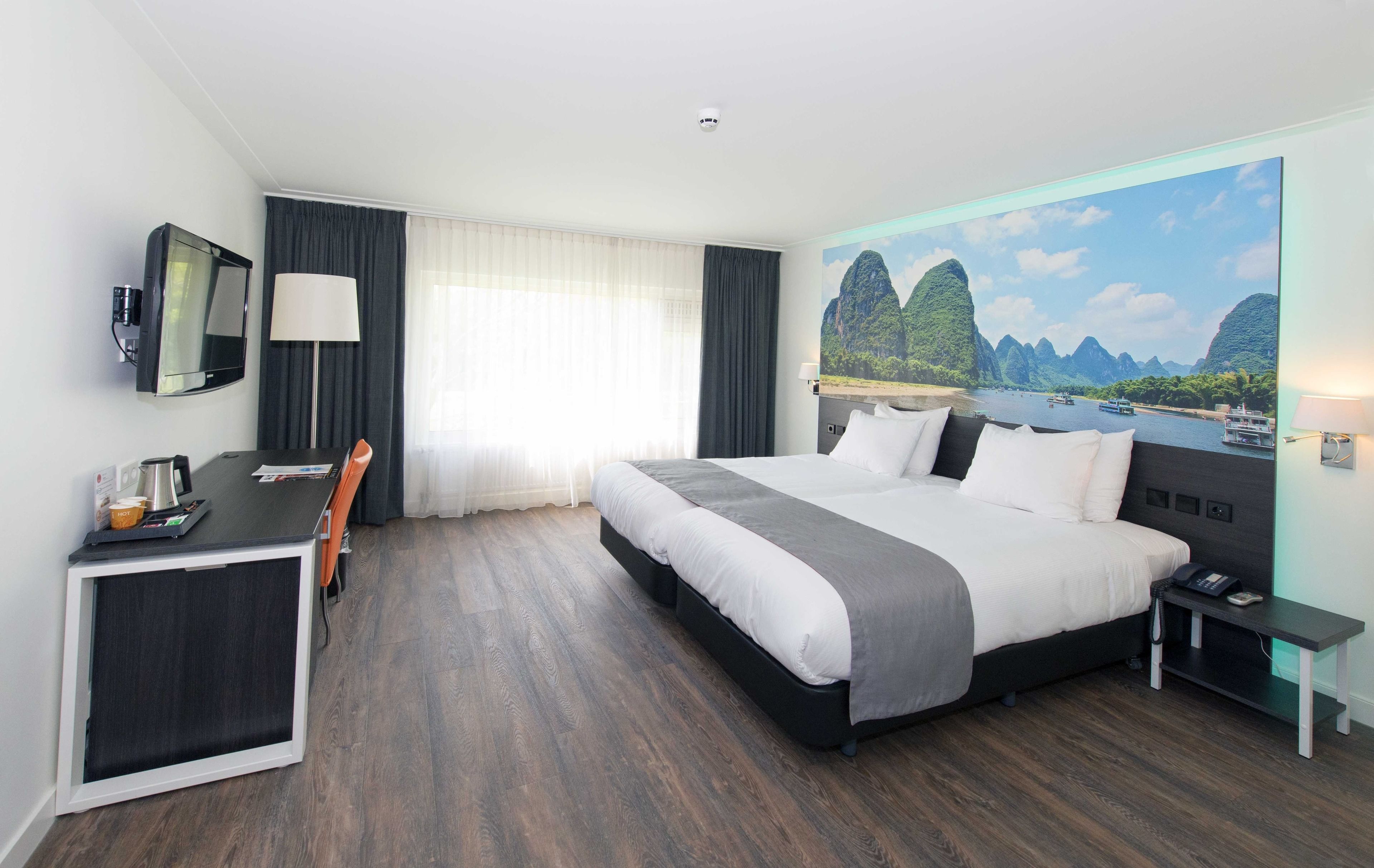 junior suite | minibar, in-room safe, desk, iron/ironing board