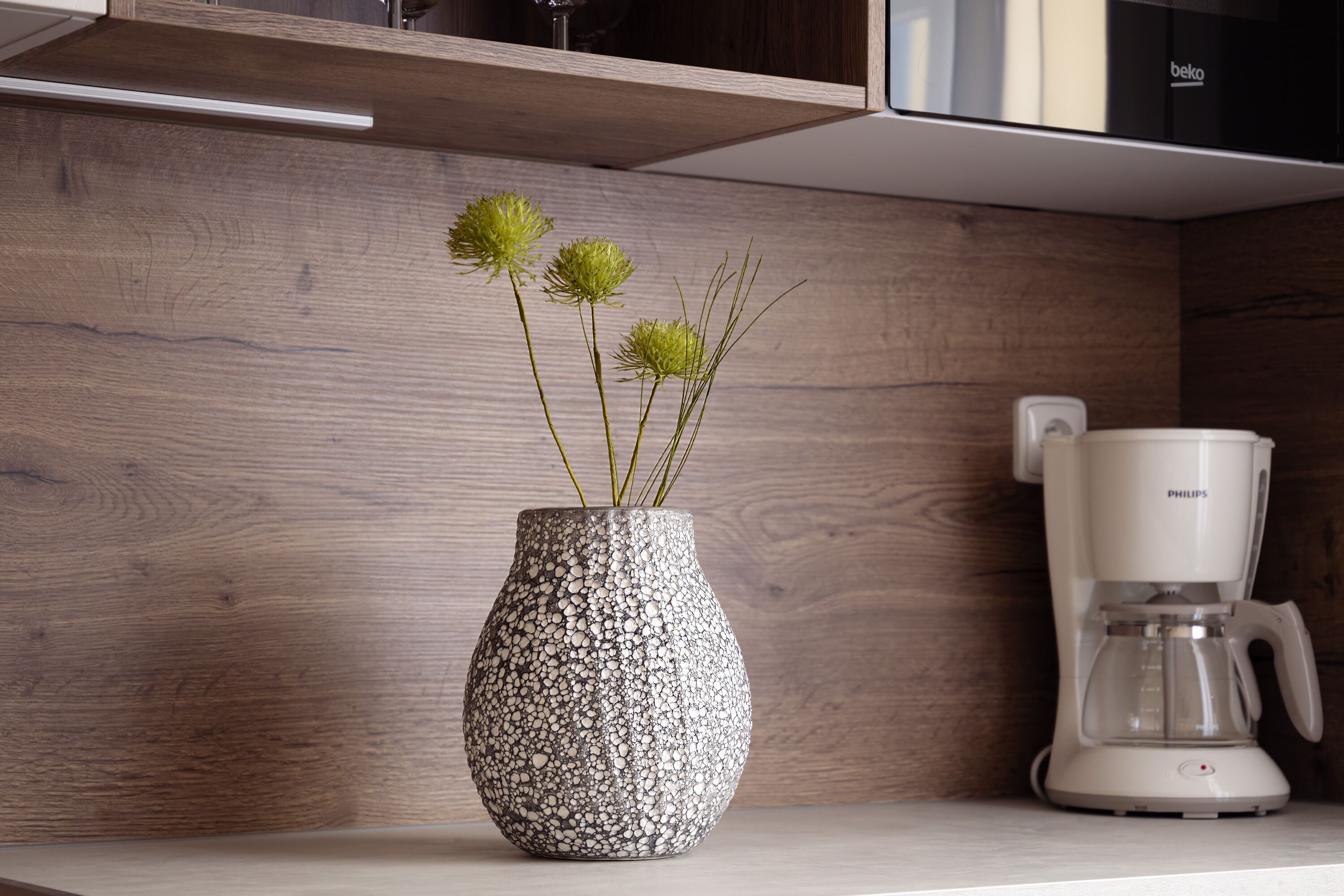 fridge, high chair, cookware/dishes/utensils, dining tables