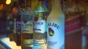 A selection of alcohol bottles on a shelf.