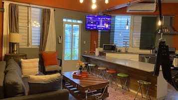 Grand Apartment, 1 King Bed with Sofa bed, Kitchen, Poolside | Living area | 32-inch Smart TV with digital channels, streaming services