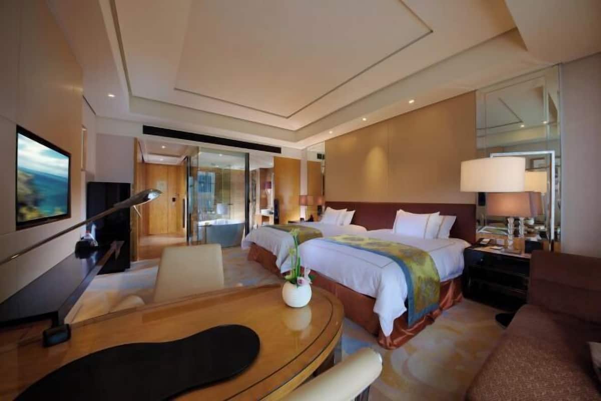 Down comforters, pillowtop beds, minibar, desk