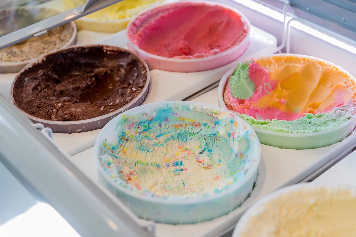 A display case with various ice cream flavors.