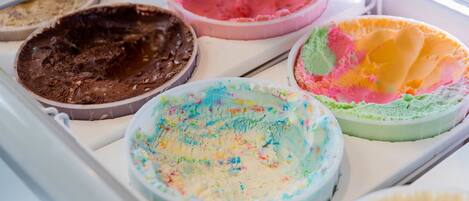 A display case with various ice cream flavors.